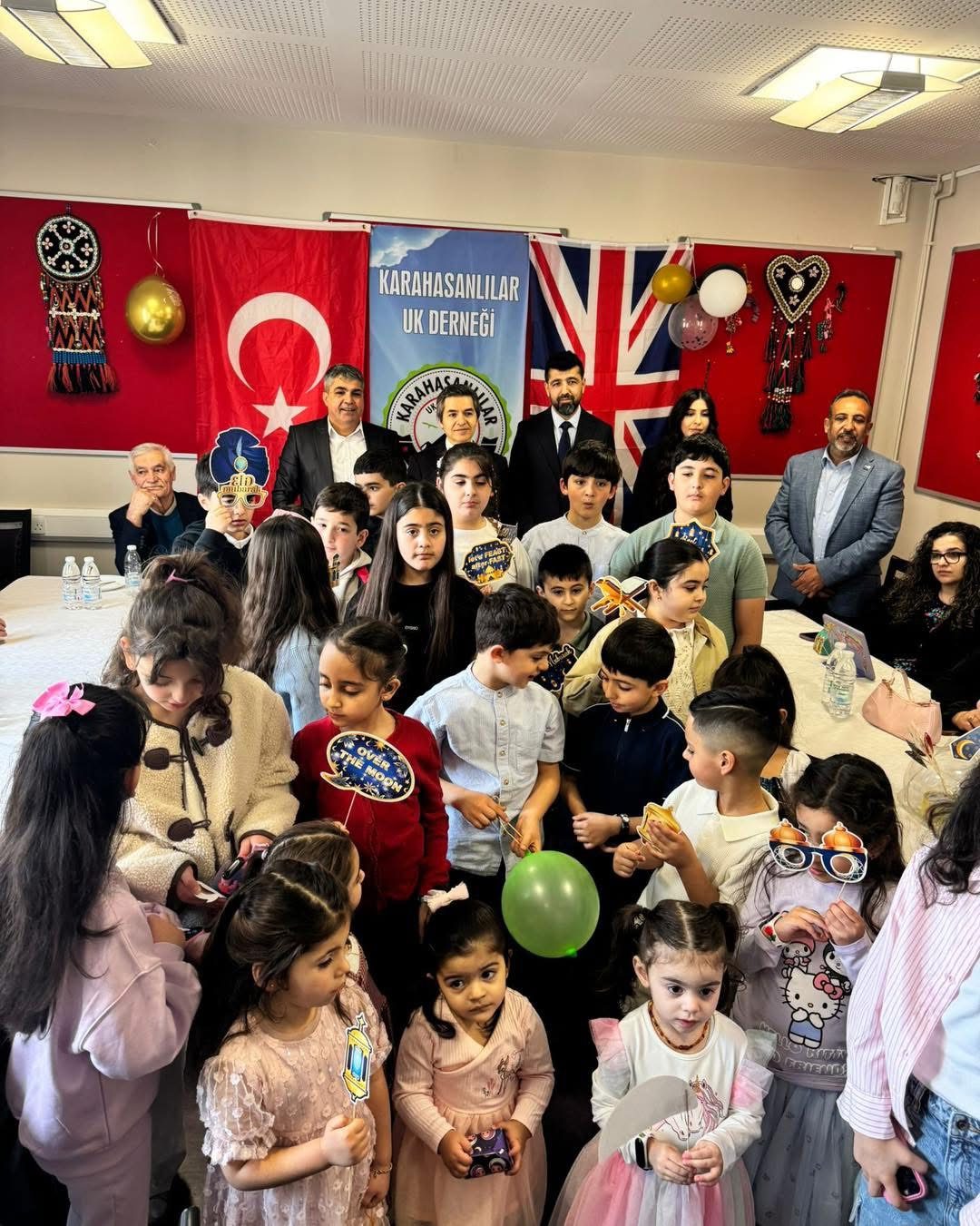 Children and community members gathered at a Karahasanlılar UK Derneği celebration